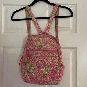 Vera Bradley mini backpack with multiple pockets and adjustable straps